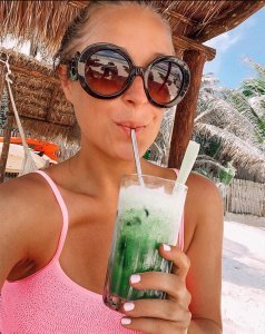 Jordan drinking a green juice.