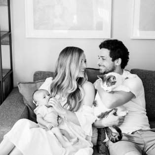 Jordan, her husband, their baby, and their cat.