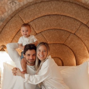 Jordan and her family on a cozy bed.